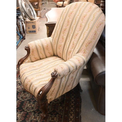 50 - A 19th century rosewood scroll-end chaise with shaped back, Regency floral striped fabric, on turned... 