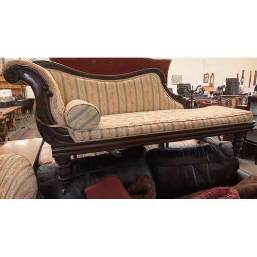 50 - A 19th century rosewood scroll-end chaise with shaped back, Regency floral striped fabric, on turned... 