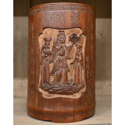 519 - A Cantonese carved bamboo bitong (brush-pot) with relief garden scene, figures and inscription, 18.5... 