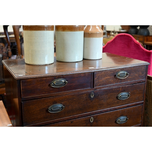 52 - A 19th century oak chest of two short over four long graduating drawers raised on shaped bracket fee... 