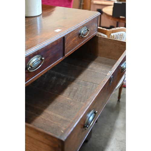 52 - A 19th century oak chest of two short over four long graduating drawers raised on shaped bracket fee... 