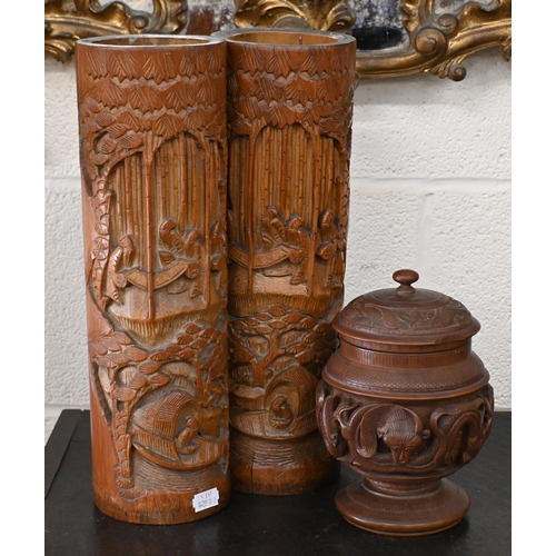 521 - Two Chinese carved bamboo bitong 46 cm high to/w a turned teak tobacco box and cover with brass reli... 