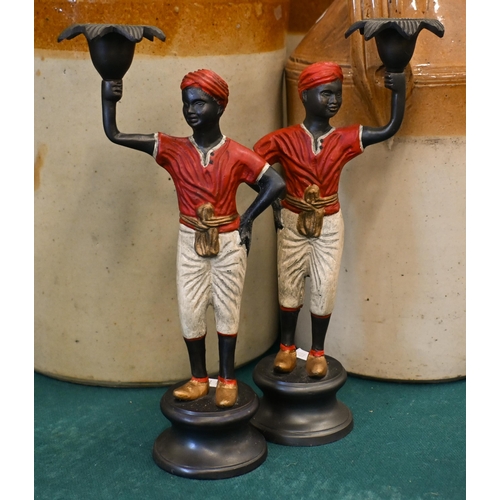 537 - Four cold-painted figural candlesticks, 28/26 cm high