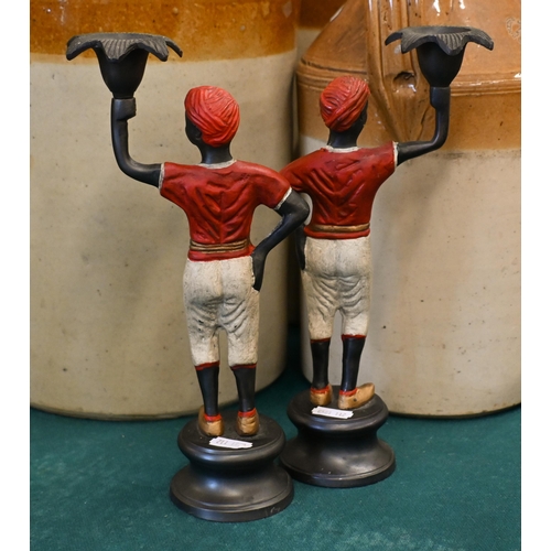 537 - Four cold-painted figural candlesticks, 28/26 cm high