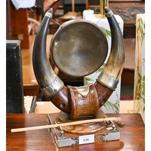 538 - An oak and cow-horn table gong with nickel mounts, 32 cm high