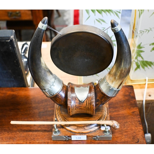 538 - An oak and cow-horn table gong with nickel mounts, 32 cm high