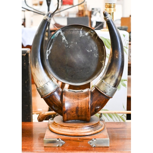 538 - An oak and cow-horn table gong with nickel mounts, 32 cm high