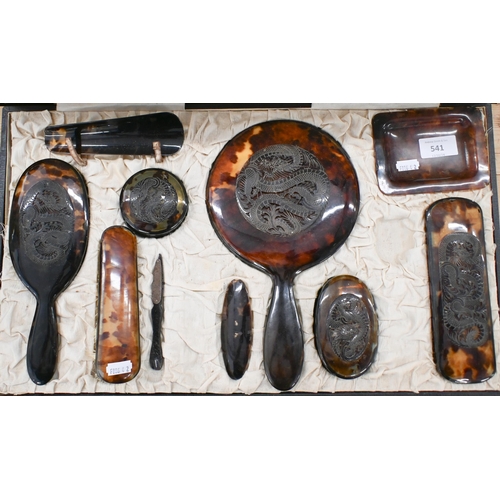 541 - A vintage Chinese tortoiseshell ten-piece dressing table set applied with carved and pierced dragon ... 