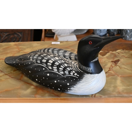 551 - A painted wood decoy 'Loon' (aquatic bird), signed Laurie Sikora no. 2-7 by Marshland Decoys, Albert... 