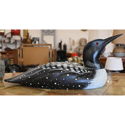 551 - A painted wood decoy 'Loon' (aquatic bird), signed Laurie Sikora no. 2-7 by Marshland Decoys, Albert... 