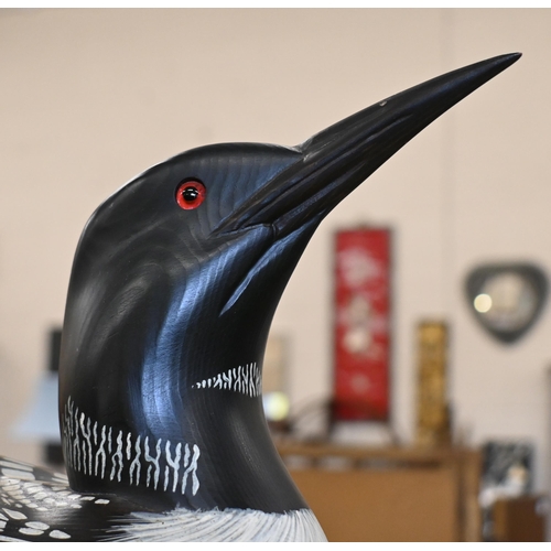 551 - A painted wood decoy 'Loon' (aquatic bird), signed Laurie Sikora no. 2-7 by Marshland Decoys, Albert... 