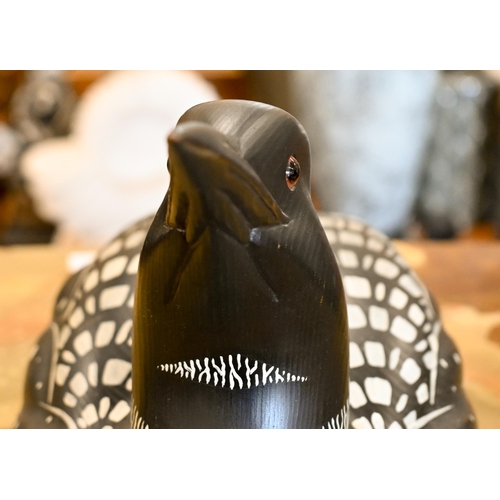 551 - A painted wood decoy 'Loon' (aquatic bird), signed Laurie Sikora no. 2-7 by Marshland Decoys, Albert... 