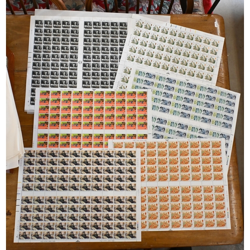 556 - A quantity of British postage stamp full sheets - mostly 1980s commemoratives, in folio case