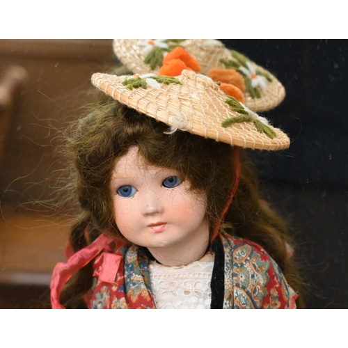 559 - # A vintage SFBJ composite doll with closing blue eyes and jointed body, 32 cm to/w a small selectio... 