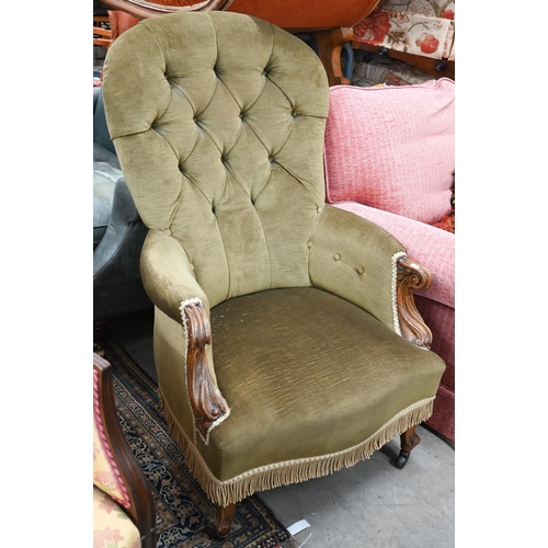 56 - A Victorian oak framed button back armchair, with green upholstery