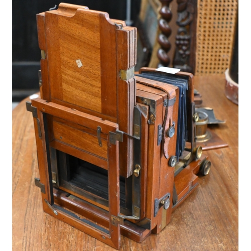 571 - An antique mahogany J Lancaster & Son half-plate camera with Beck Symmetrical lens and Lancaster... 