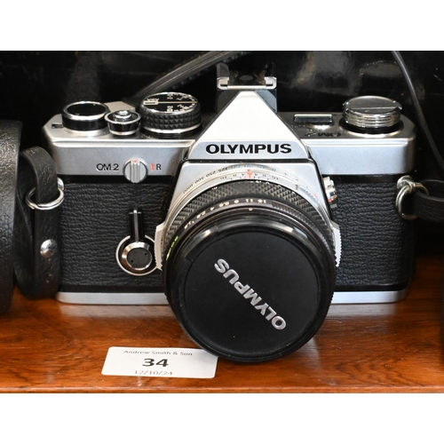 578 - An Olympus OM2 SLR camera with OM system, F Zuiko Auto S 1:1:8 f=50mm lens, Osawa MC 1;3.5-4.5 24-43... 