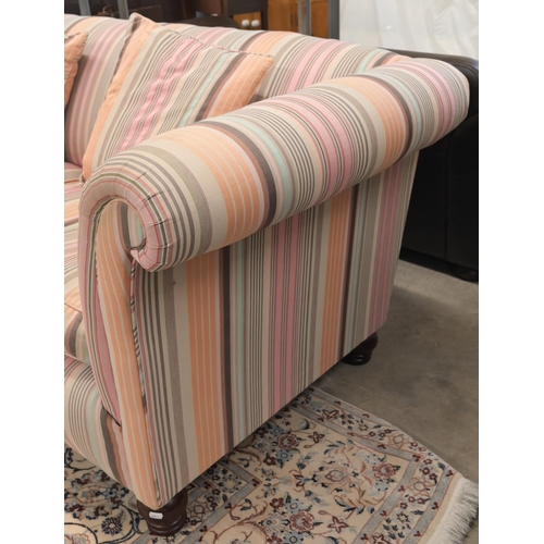 63 - A scroll arm Chesterfield Derwent 'Keat' sofa with 'Kenzo' multi-coloured striped fabric upholstery,... 