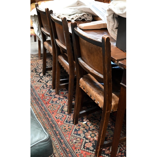 65 - Four oak framed dining chairs with studded brown vinyl backs and seats in the Cromwellian manner (4)