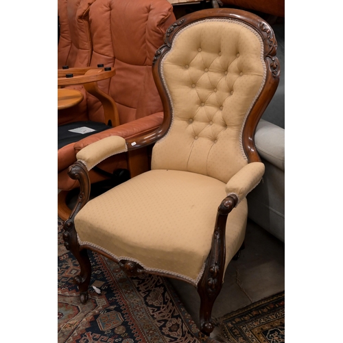 66 - A Victorian mahogany open armchair in old gold button back upholstery