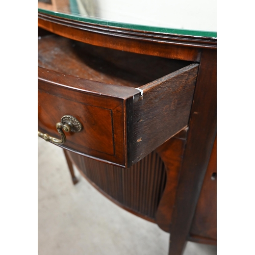 67 - A mahogany demi-lune sideboard with cupboard doors flanking central drawer over sliding tambour door... 