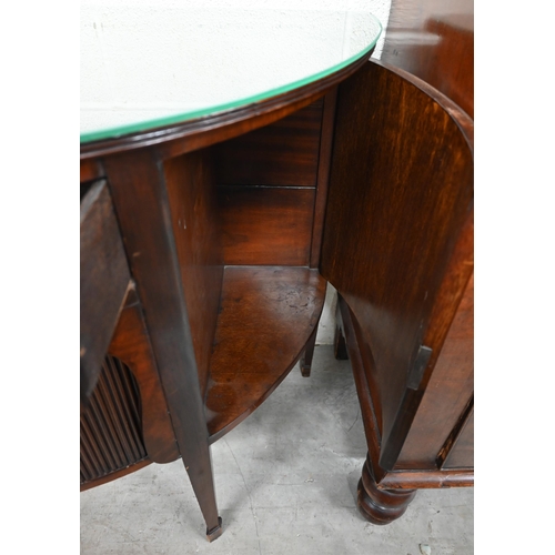 67 - A mahogany demi-lune sideboard with cupboard doors flanking central drawer over sliding tambour door... 