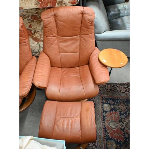 69 - Ekornes Stressless Mayfair reclining armchair in tan leather with swing side table and footstool, 80... 