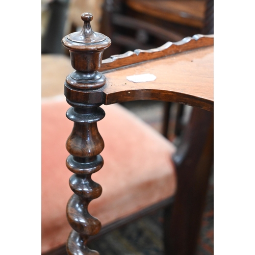 71 - A Victorian rosewood three-tier corner whatnot with barleytwist supports, short turned legs and cast... 