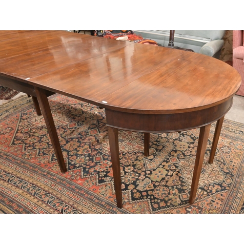 72 - A 19th century mahogany extending dining table with drop-leaf centre between two 'D' ends, raised on... 