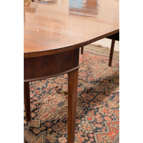 72 - A 19th century mahogany extending dining table with drop-leaf centre between two 'D' ends, raised on... 