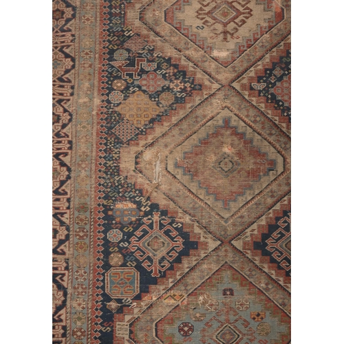 73 - An antique Persian Qashai kelleigh rug, stylised design on navy ground with repeating borders, 266 x... 