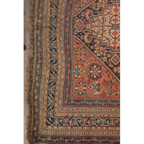 73 - An antique Persian Qashai kelleigh rug, stylised design on navy ground with repeating borders, 266 x... 