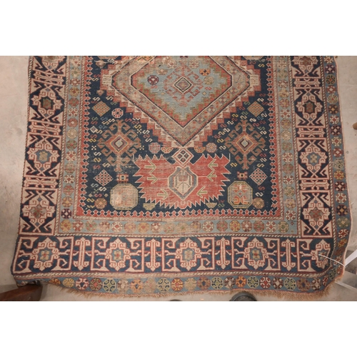 73 - An antique Persian Qashai kelleigh rug, stylised design on navy ground with repeating borders, 266 x... 