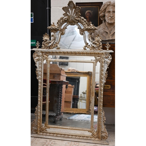 76 - A large Italian reproduction mirror in ornate aged gilt frame with anthemion crest, 95 cm wide x 160... 