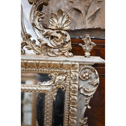 76 - A large Italian reproduction mirror in ornate aged gilt frame with anthemion crest, 95 cm wide x 160... 