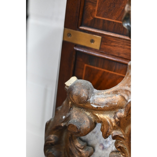 77 - A Chippendale style mirror with antiqued glass and decorative foliate gilt frame, a/f