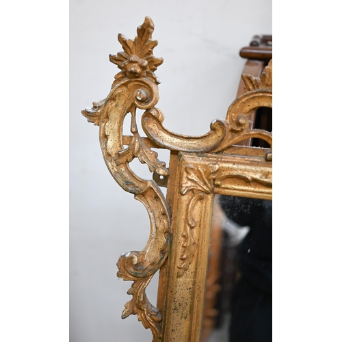 78 - An Italian reproduction mirror in decorative foliate carved gilt frame in 18th century manner, 100 c... 