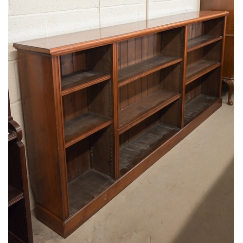 8 - A 19th century mahogany open bookcase with three unequal divisions, each having two adjustable shelv... 