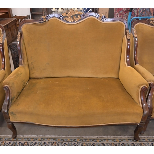 83 - An early 20th century mahogany and gilt framed salon suite in old gold dralon upholstery comprising ... 