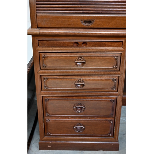 88 - A Chinese hardwood tambour roll-top desk with fitted interior over six drawers with 'shou' symbol ha... 