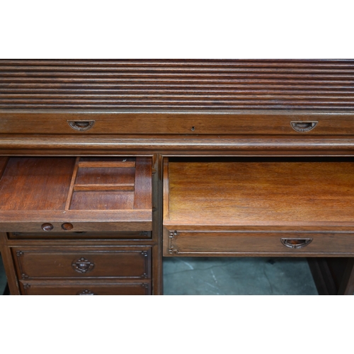 88 - A Chinese hardwood tambour roll-top desk with fitted interior over six drawers with 'shou' symbol ha... 