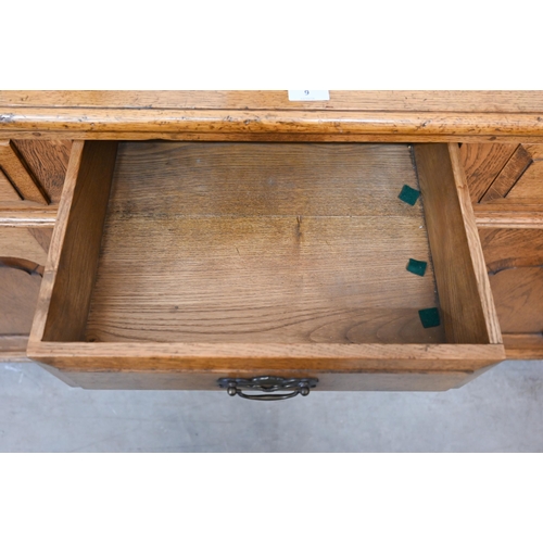 9 - A good quality reproduction oak dresser with three drawers over three panelled cupboards, in the 18t... 