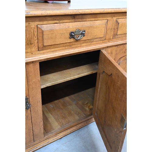 9 - A good quality reproduction oak dresser with three drawers over three panelled cupboards, in the 18t... 