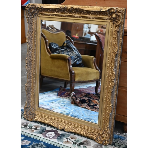 90 - A rectangular wall mirror in antique giltwood and gesso frame, 84 cm high x 102 cm high