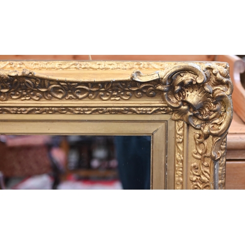 90 - A rectangular wall mirror in antique giltwood and gesso frame, 84 cm high x 102 cm high