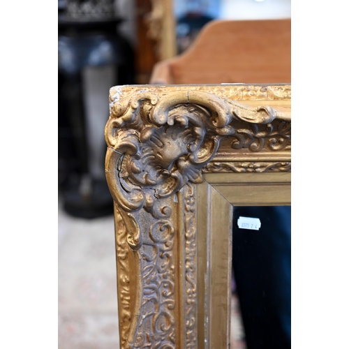 90 - A rectangular wall mirror in antique giltwood and gesso frame, 84 cm high x 102 cm high