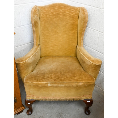 94 - An Edwardian wingback armchair with cabriole front legs, old gold dralon upholstery