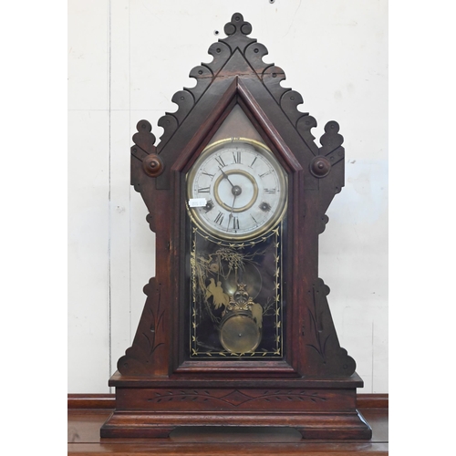 96 - An antique American 'gingerbread' mantel clock with eight-day twin train movement striking on bell c... 