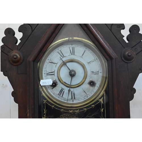 96 - An antique American 'gingerbread' mantel clock with eight-day twin train movement striking on bell c... 