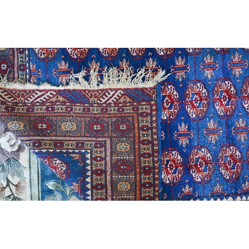 98 - A Pakistani Turkoman design blue ground rug with repeating teke gul design, 190 x 128 cm